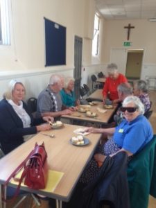 Parish members enjoying their frugal lunch of bread and soup